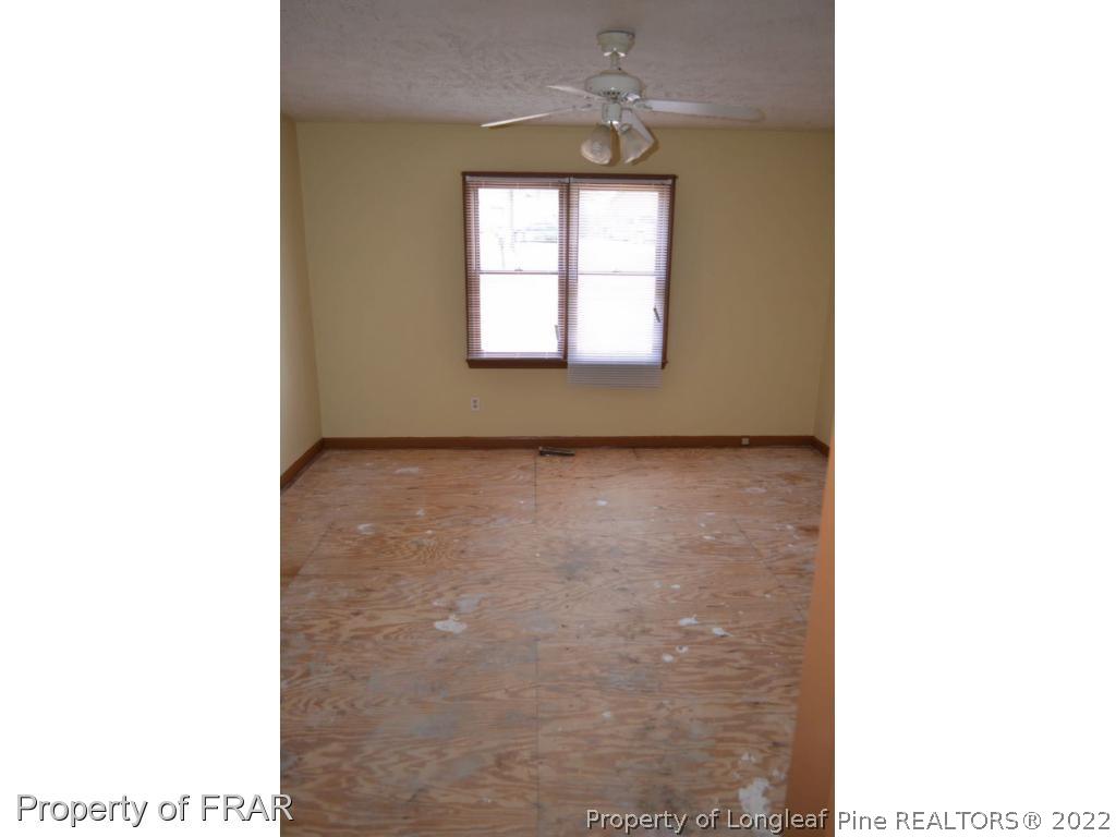 110 Bruce Lane Spring Lake, NC 28390 - Photo 13 of 21 a picture of a room with a window and a fireplace
