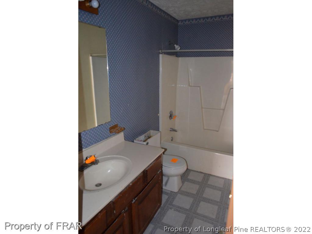 110 Bruce Lane Spring Lake, NC 28390 - Photo 21 of 21 a bathroom with a sink and a tub