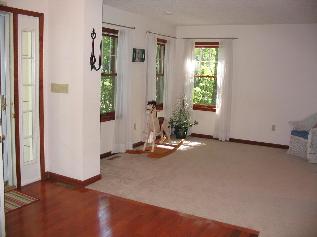 106 Kelly Road Stroudsburg, PA 18360 - Photo 6 of 18 a view of a room with gym equipment and windows