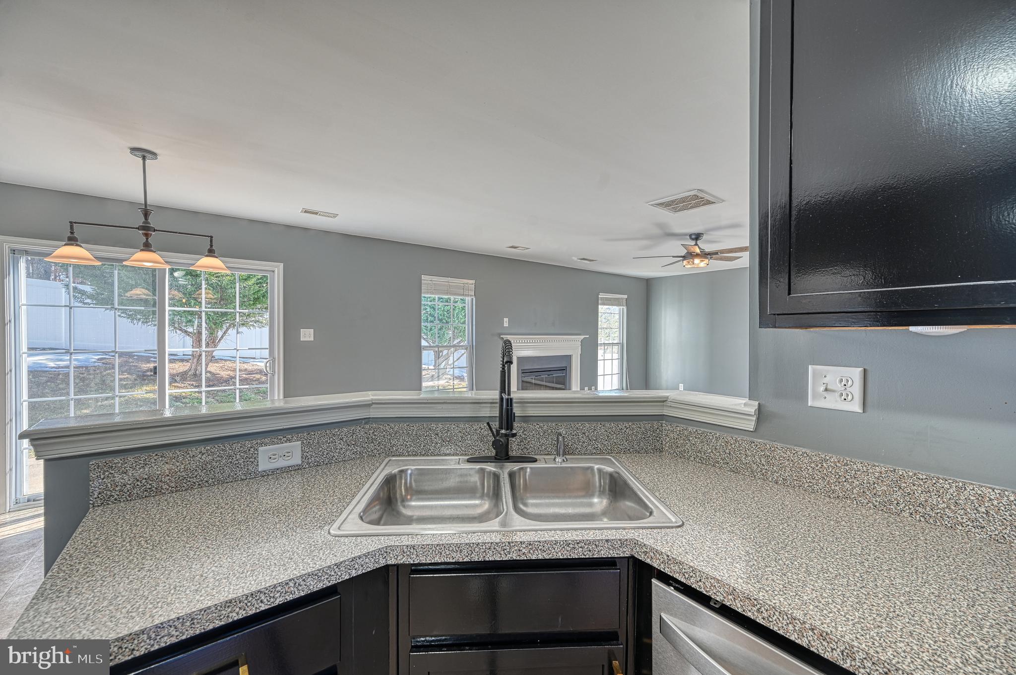 343 Cardinal Road Louisa, VA 23093 - Photo 14 of 48 a kitchen with granite countertop a sink and a window