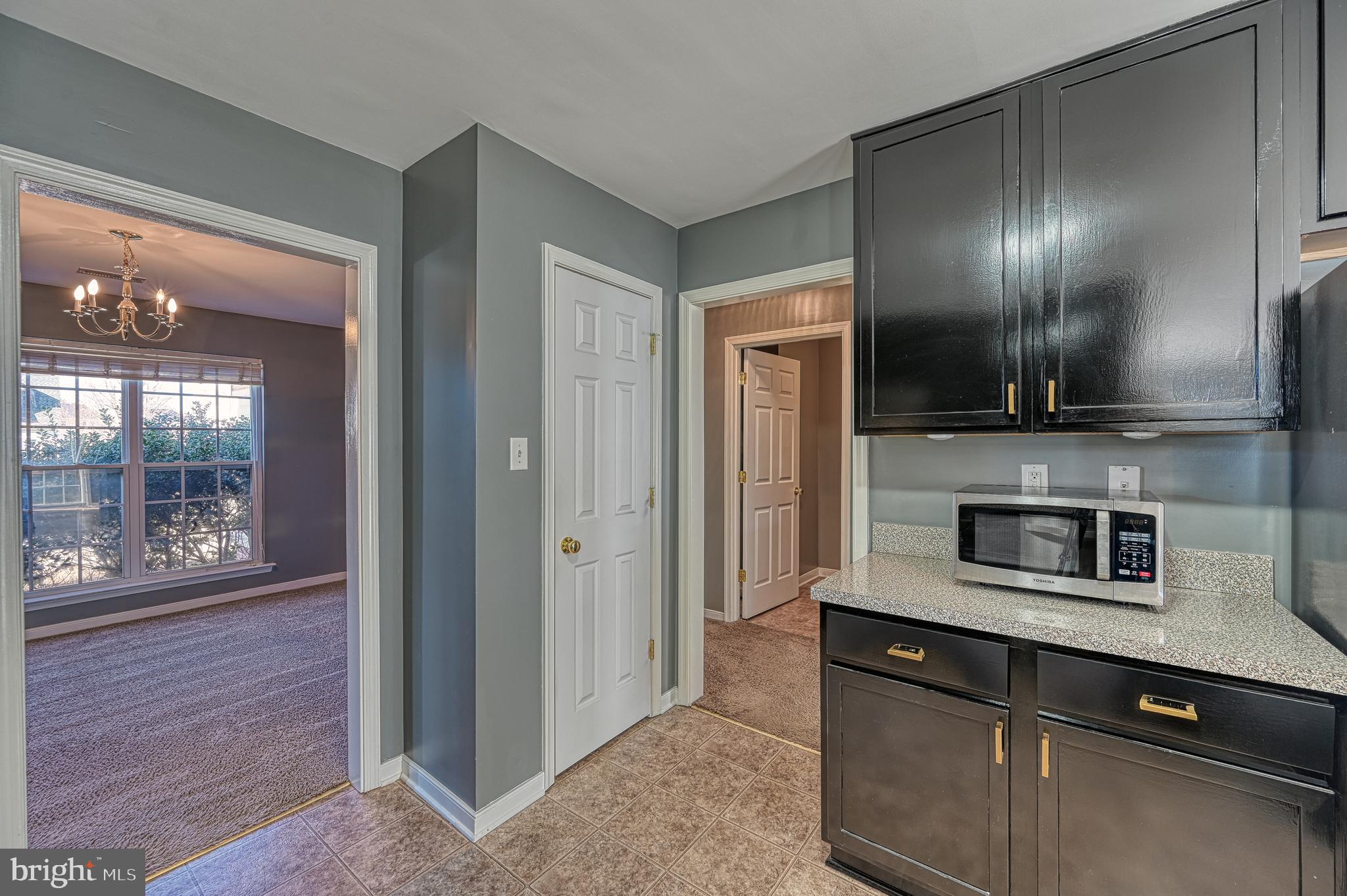 343 Cardinal Road Louisa, VA 23093 - Photo 16 of 48 a kitchen with stainless steel appliances granite countertop a refrigerator and a sink