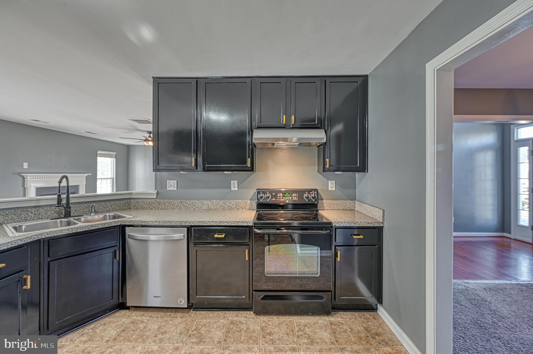 343 Cardinal Road Louisa, VA 23093 - Photo 18 of 48 a kitchen with a stove and a sink