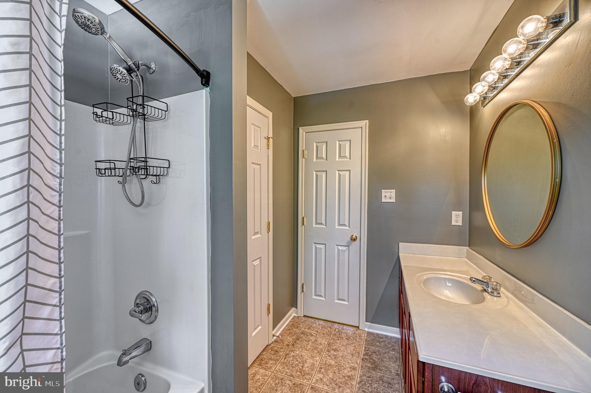 343 Cardinal Road Louisa, VA 23093 - Photo 35 of 48 a bathroom with a sink a toilet and shower