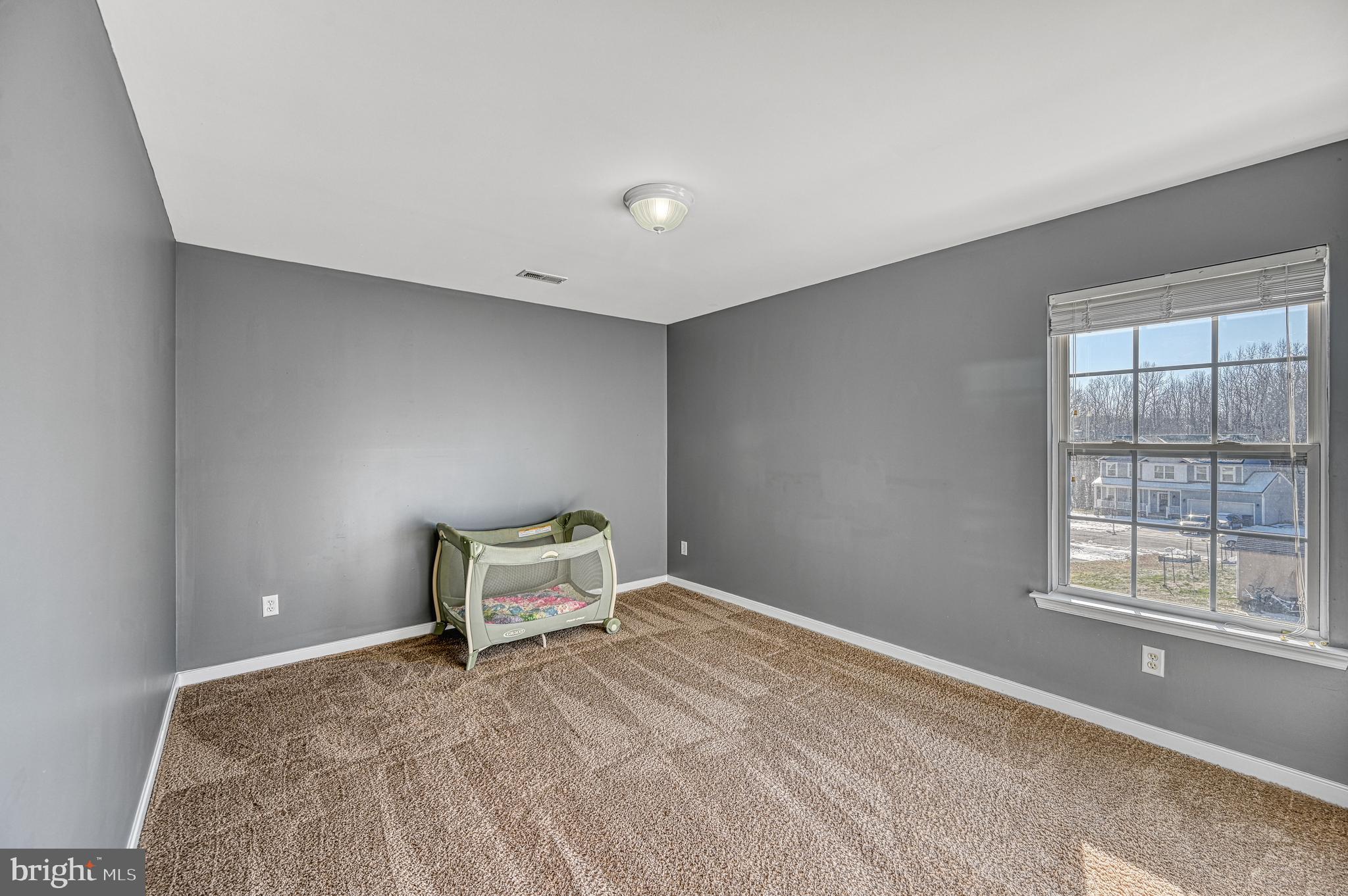 343 Cardinal Road Louisa, VA 23093 - Photo 39 of 48 a bedroom with a bed and window