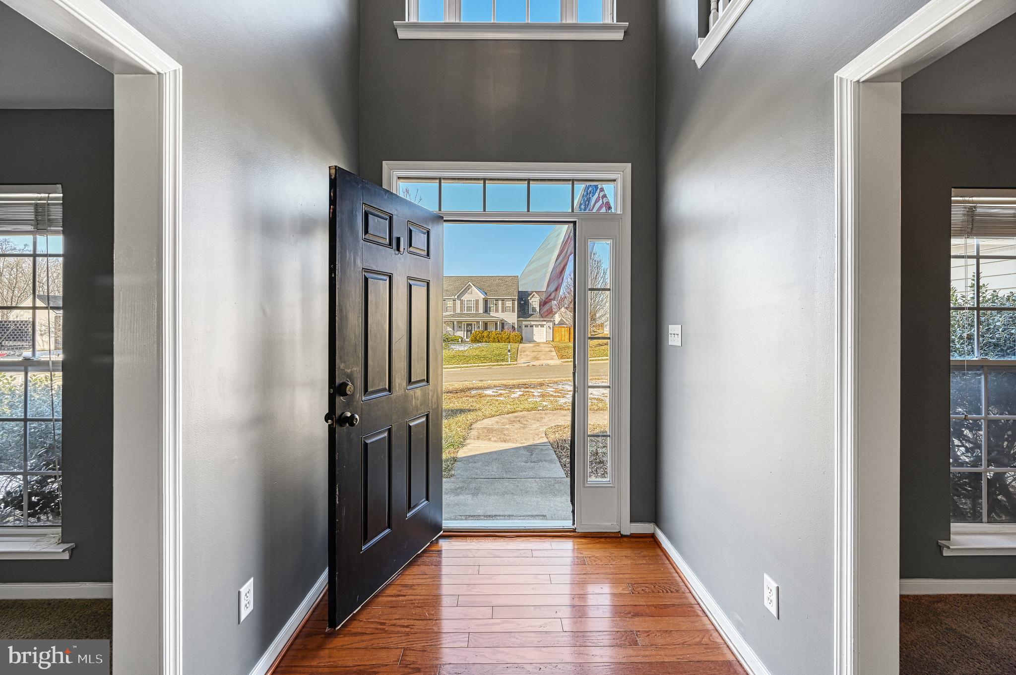 343 Cardinal Road Louisa, VA 23093 - Photo 4 of 48 a view of a hallway with wooden floor and a bathroom