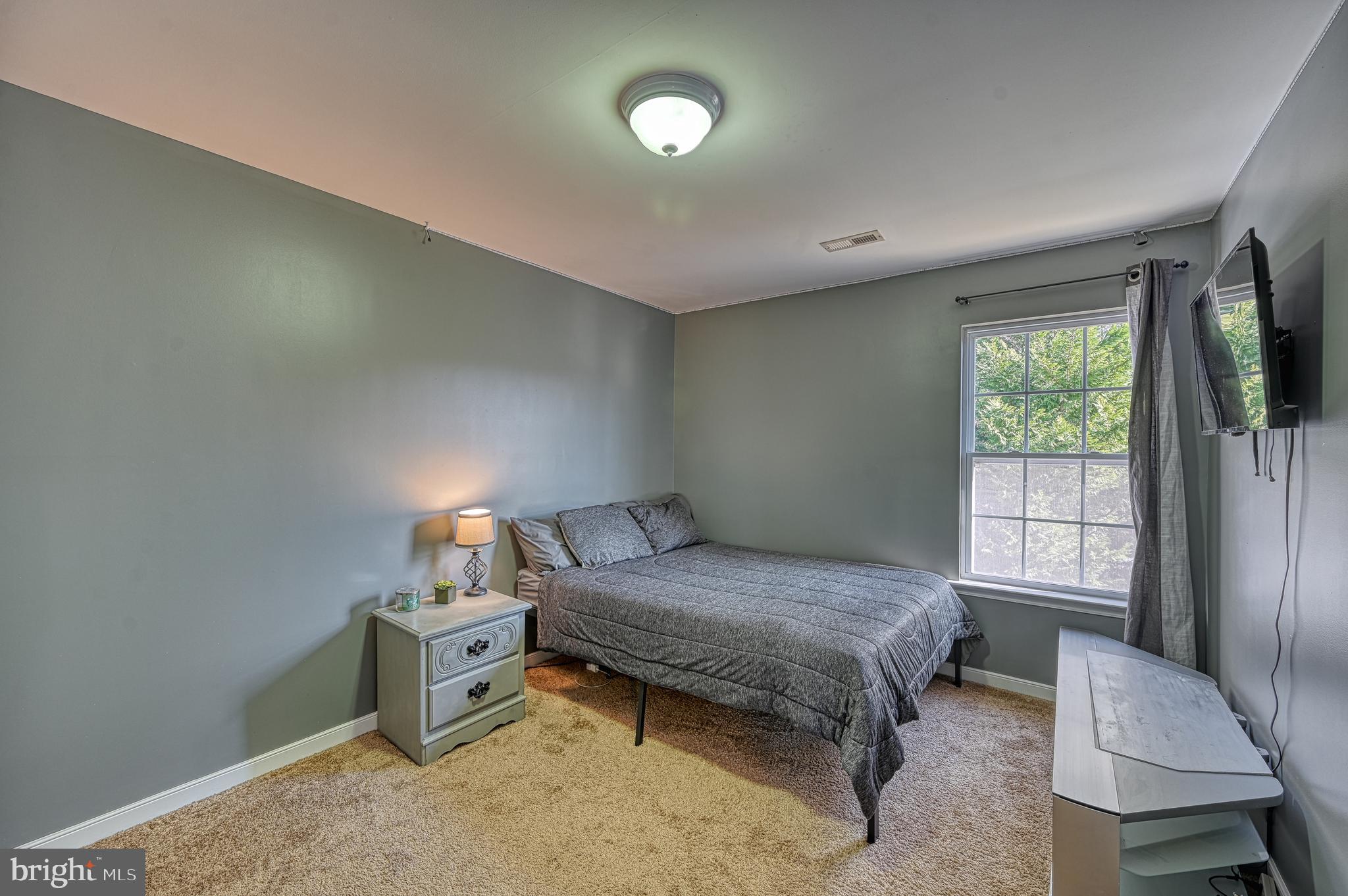 343 Cardinal Road Louisa, VA 23093 - Photo 41 of 48 a bedroom with a bed and a window