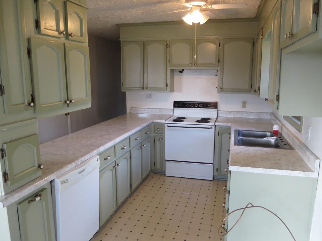 4171 6 Mile Post Road Rocky Mount, VA 24151 - Photo 2 of 10 a kitchen with a stove sink and cabinets