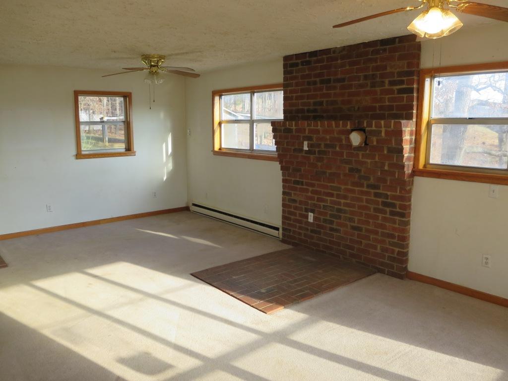 4171 6 Mile Post Road Rocky Mount, VA 24151 - Photo 3 of 10 an empty room with windows