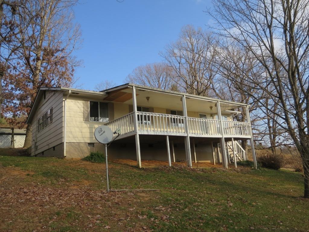 4171 6 Mile Post Road Rocky Mount, VA 24151 - Photo 9 of 10 a front view of a house with a yard and garage
