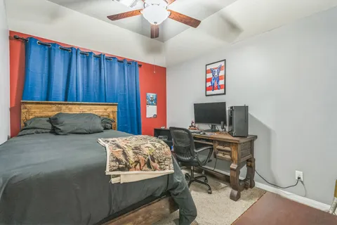 a bedroom with a bed and furniture
