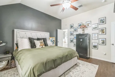 a bedroom with a bed and a walk in closet