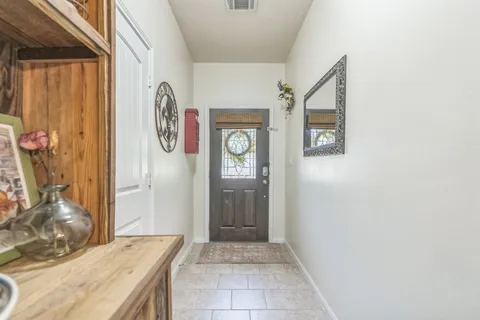a bathroom with a granite countertop shower and a sink