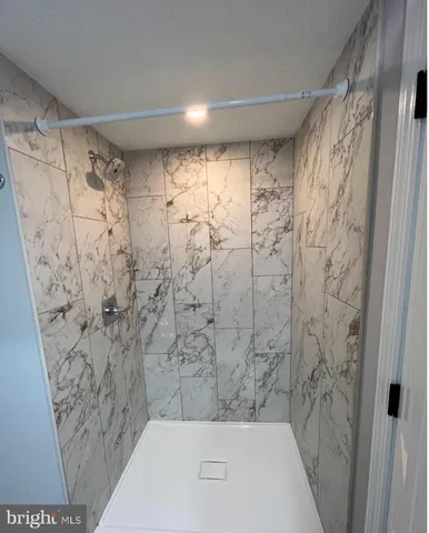 a bathroom with a shower curtain