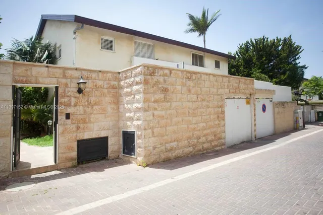 a front view of a house with a garage