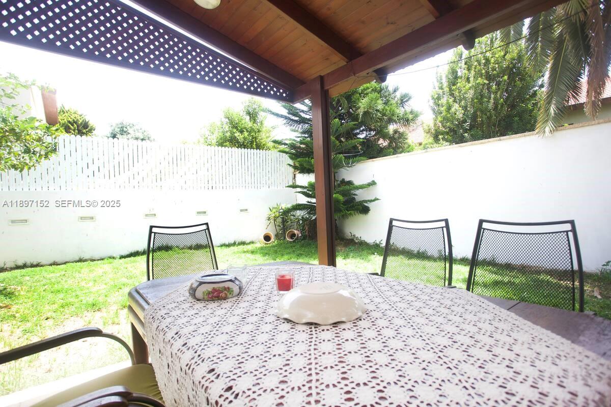 10 Hapiyyus Fort Wayne, IL 46814 - Photo 21 of 31 a backyard of a house with table and chairs