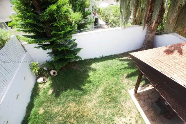 a living room with furniture and a lamp