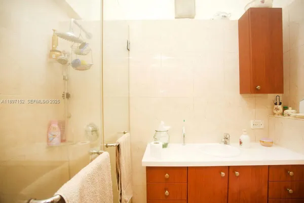 a dining room with furniture and a floor to ceiling window