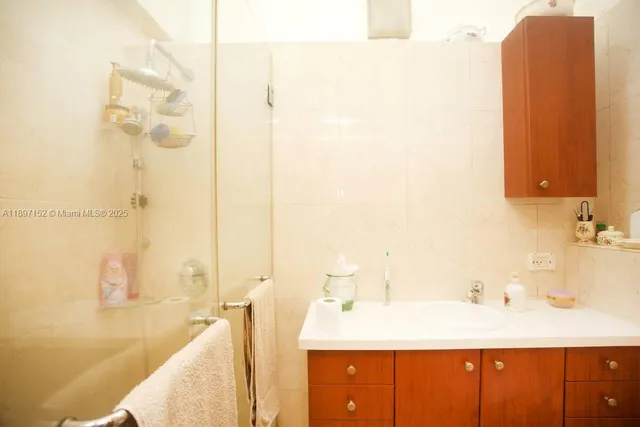 a dining room with furniture and a floor to ceiling window