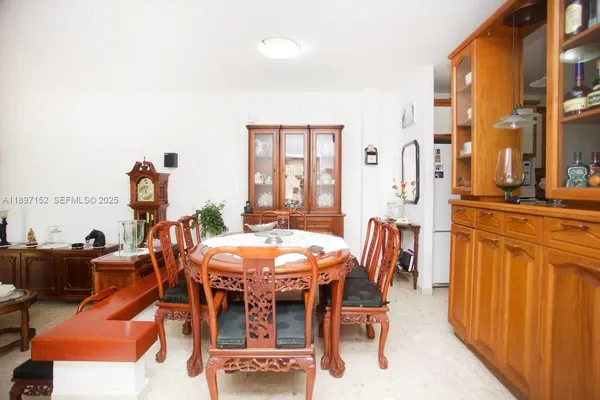 a room with a workspace and a window