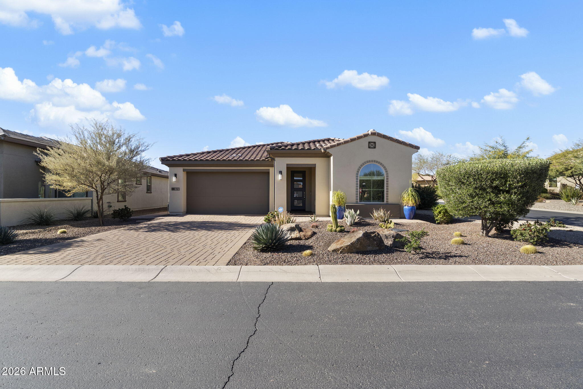 a front view of a house with yard and outdoor seating