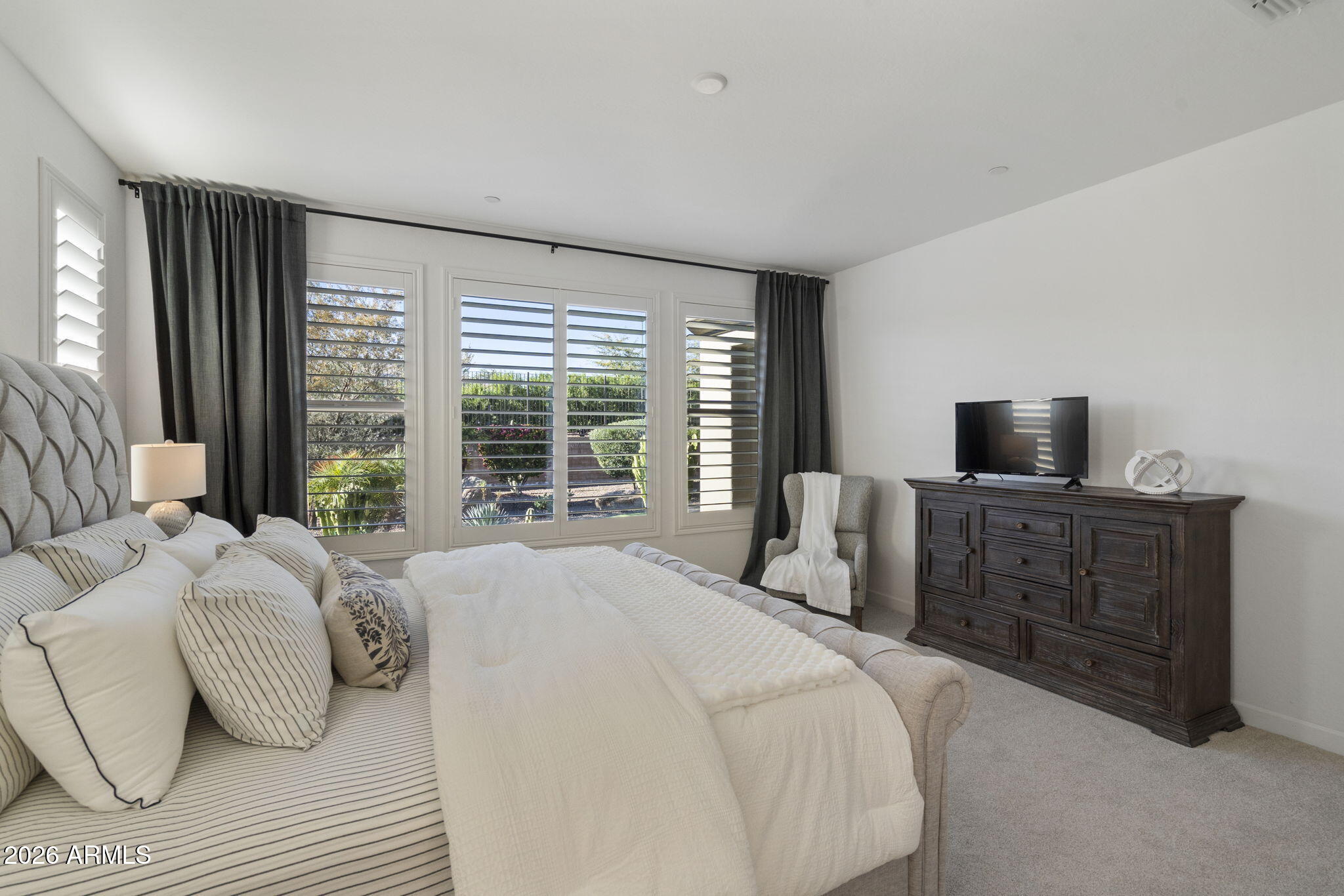 17521 East Silver Sage Lane Rio Verde, AZ 85263 - Photo 11 of 27 a bedroom with a bed and large windows