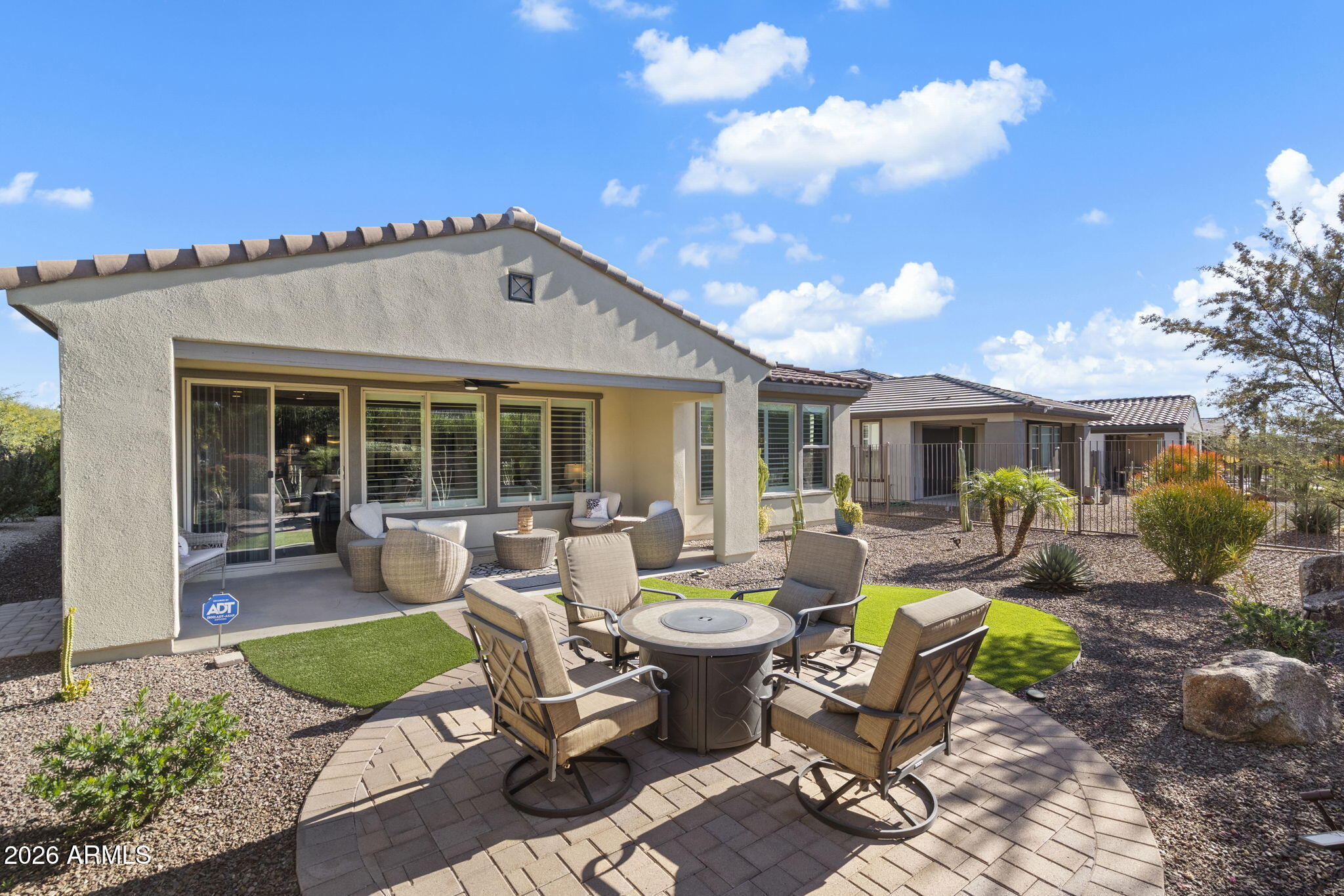17521 East Silver Sage Lane Rio Verde, AZ 85263 - Photo 17 of 27 a view of a house with backyard sitting area and garden