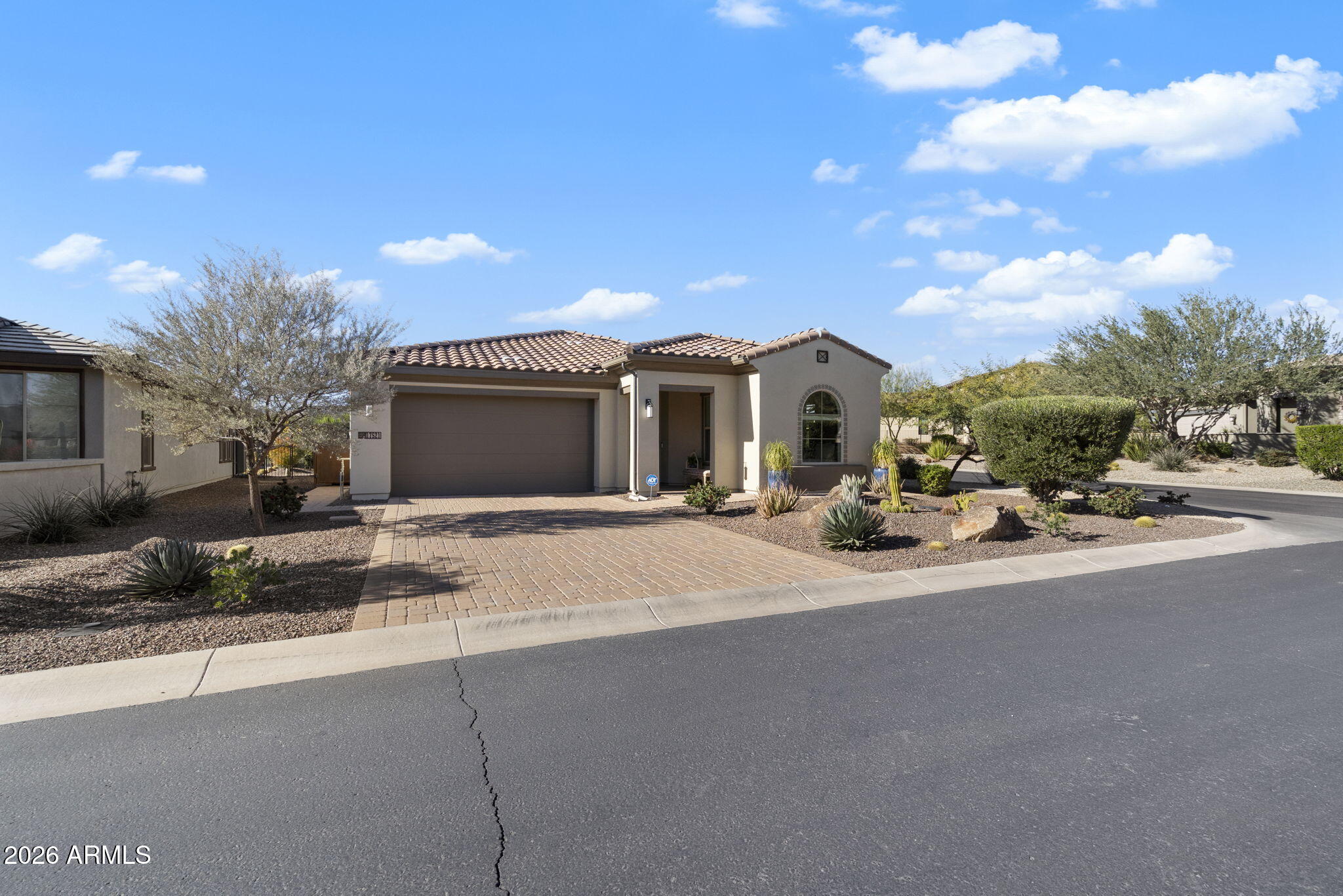 17521 East Silver Sage Lane Rio Verde, AZ 85263 - Photo 3 of 27 a front view of a house with a yard and garage
