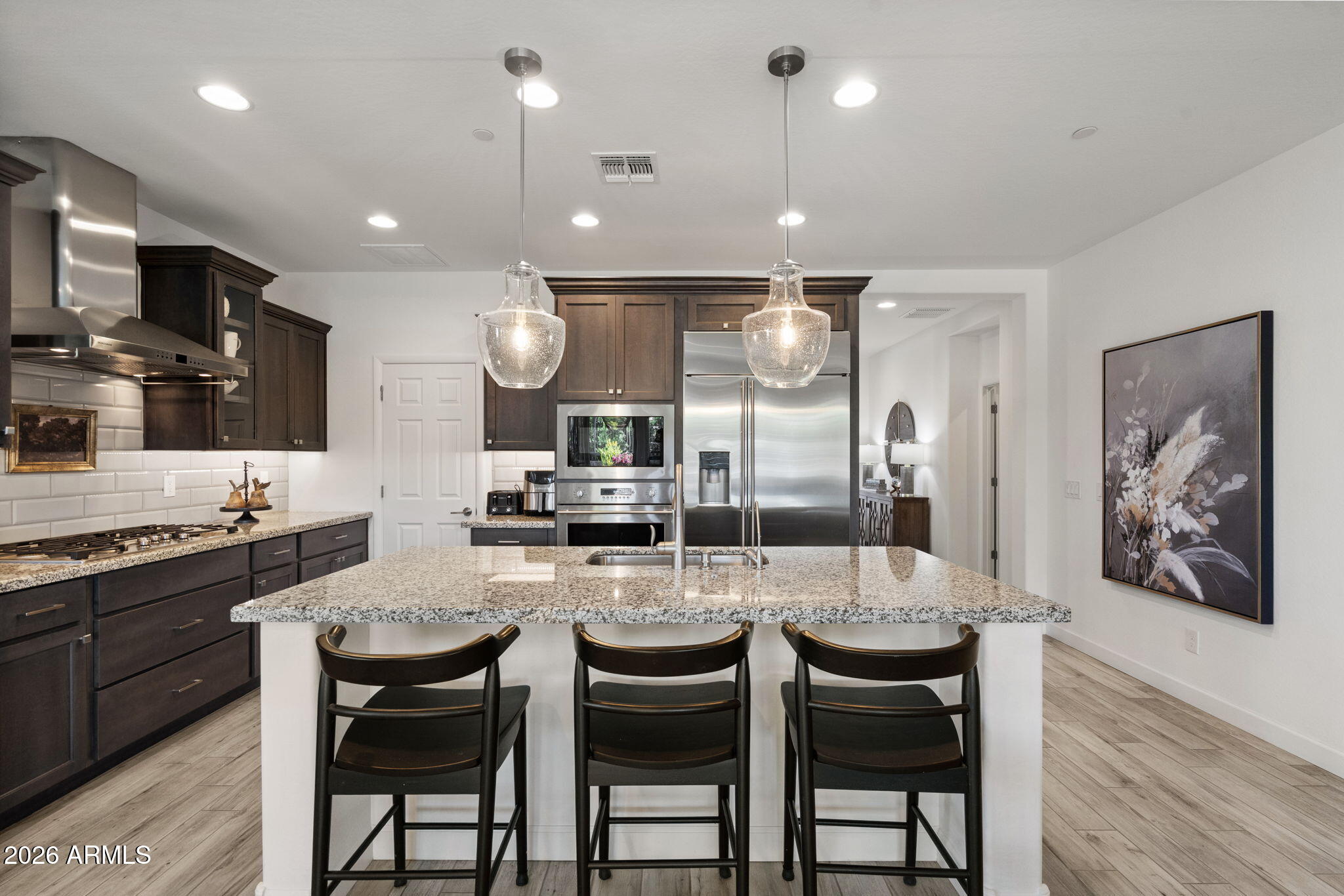 17521 East Silver Sage Lane Rio Verde, AZ 85263 - Photo 7 of 27 a kitchen with granite countertop a sink and chairs