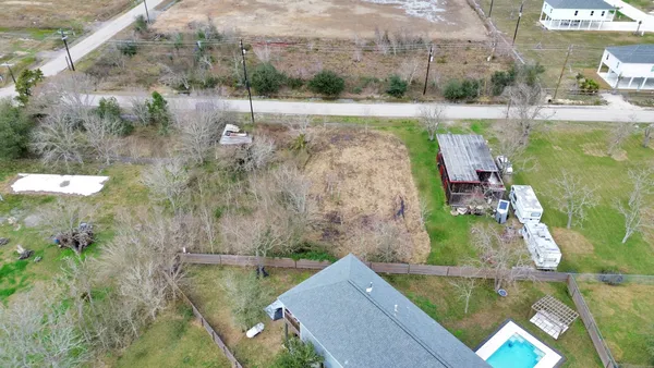 a aerial view of a house with a yard