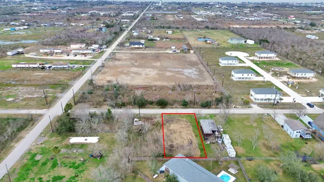 an aerial view of a house with a yard basket ball court