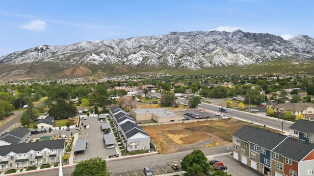 295 Spruce Way Santaquin, UT 84655 - Photo 27 of 32 Aerial perspective showcasing a residential area with a prominent snow-capped mountain range in the background