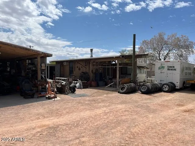 a view of a patio with furniture and a fire pit