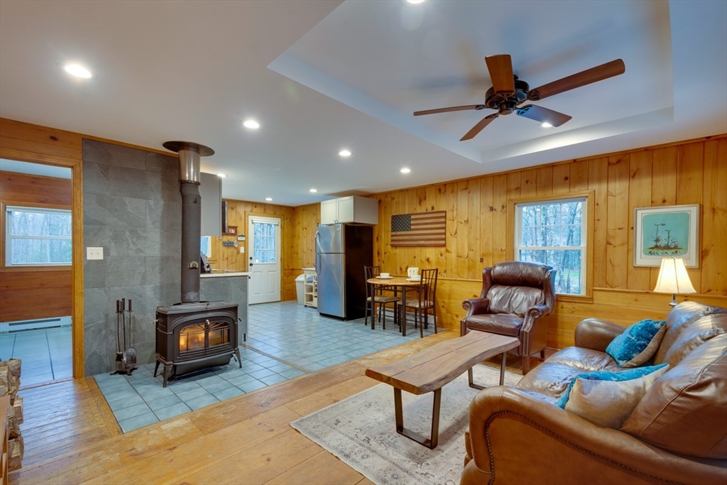 100 Dunn Road Ashburnham, MA 01430 - Photo 11 of 31 a living room with furniture and a wooden floor