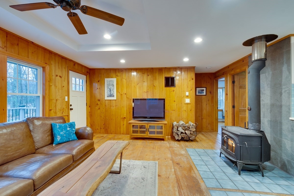 100 Dunn Road Ashburnham, MA 01430 - Photo 14 of 31 a living room with furniture and a flat screen tv