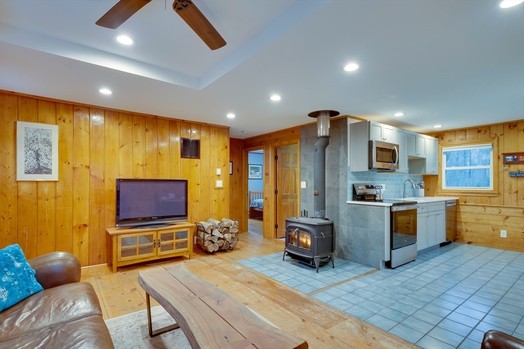 100 Dunn Road Ashburnham, MA 01430 - Photo 15 of 31 a living room with furniture and a flat screen tv