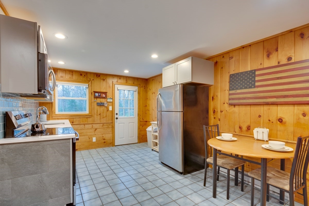100 Dunn Road Ashburnham, MA 01430 - Photo 18 of 31 a kitchen with refrigerator and window