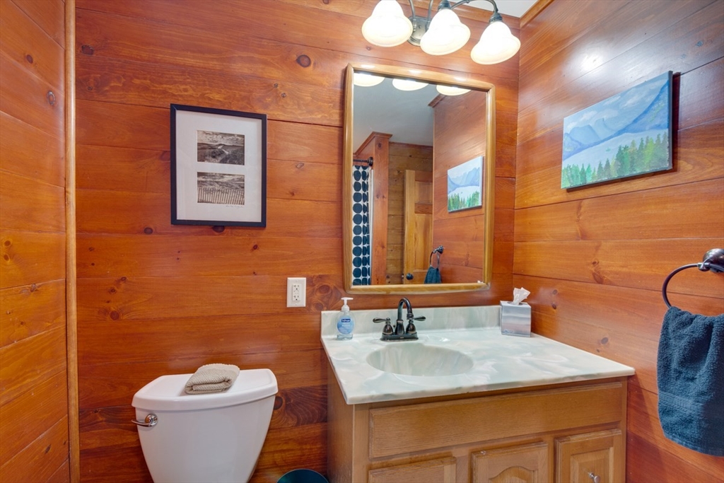 100 Dunn Road Ashburnham, MA 01430 - Photo 20 of 31 a bathroom with a toilet sink and mirror
