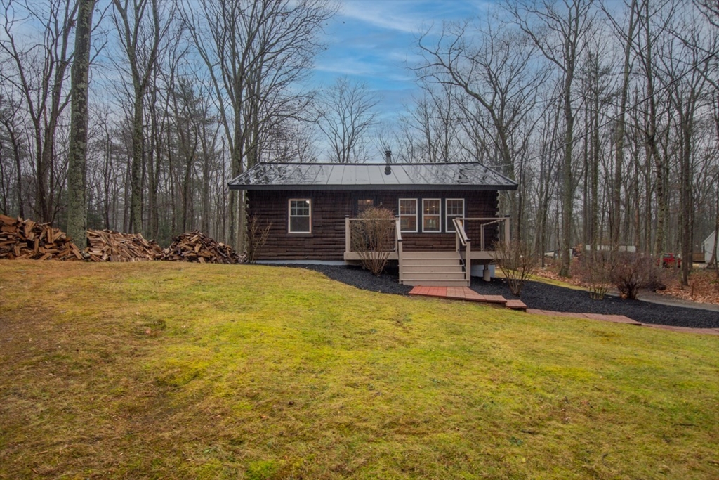 100 Dunn Road Ashburnham, MA 01430 - Photo 5 of 31 a view of a house with swimming pool and sitting area