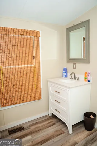 a bathroom with a sink and a mirror