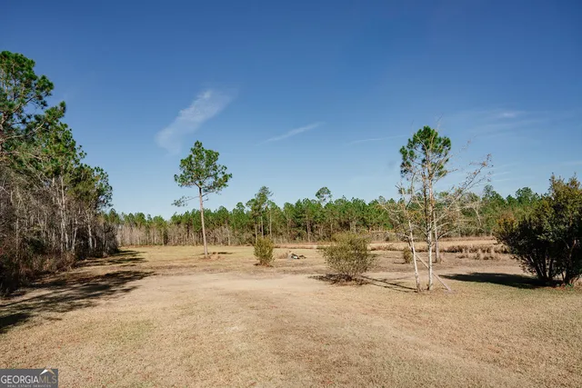 a view of a road with a yard