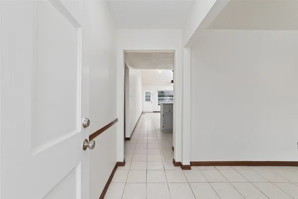 a view of a hallway view with staircase