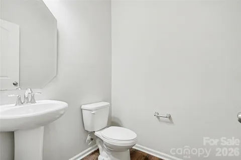 an empty room with closet and windows