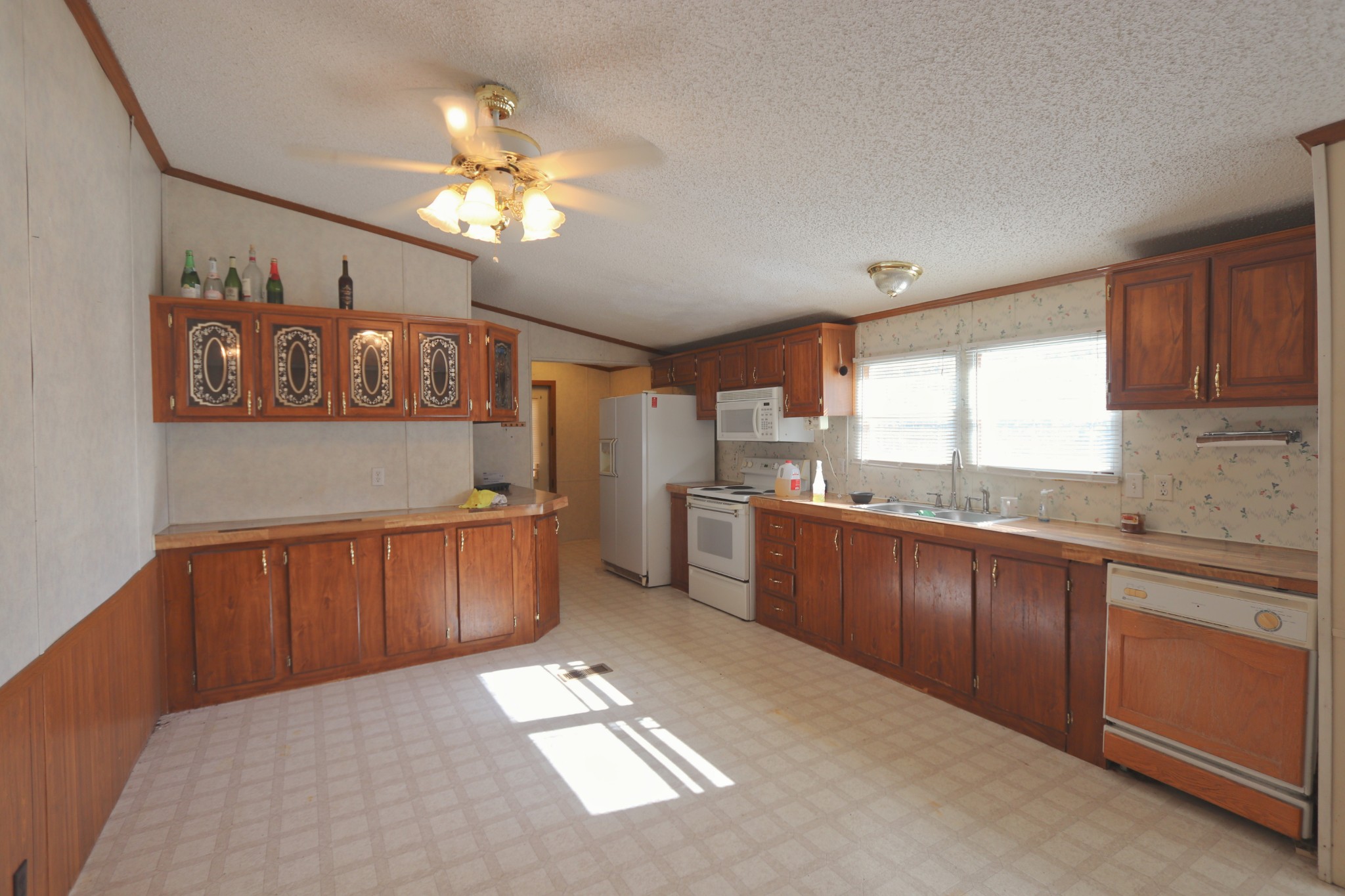 2051 Canoe Branch Road Lebanon, TN 37087 - Photo 5 of 18 a kitchen with stainless steel appliances granite countertop a refrigerator a sink dishwasher a oven a dining table and chairs with wooden floor