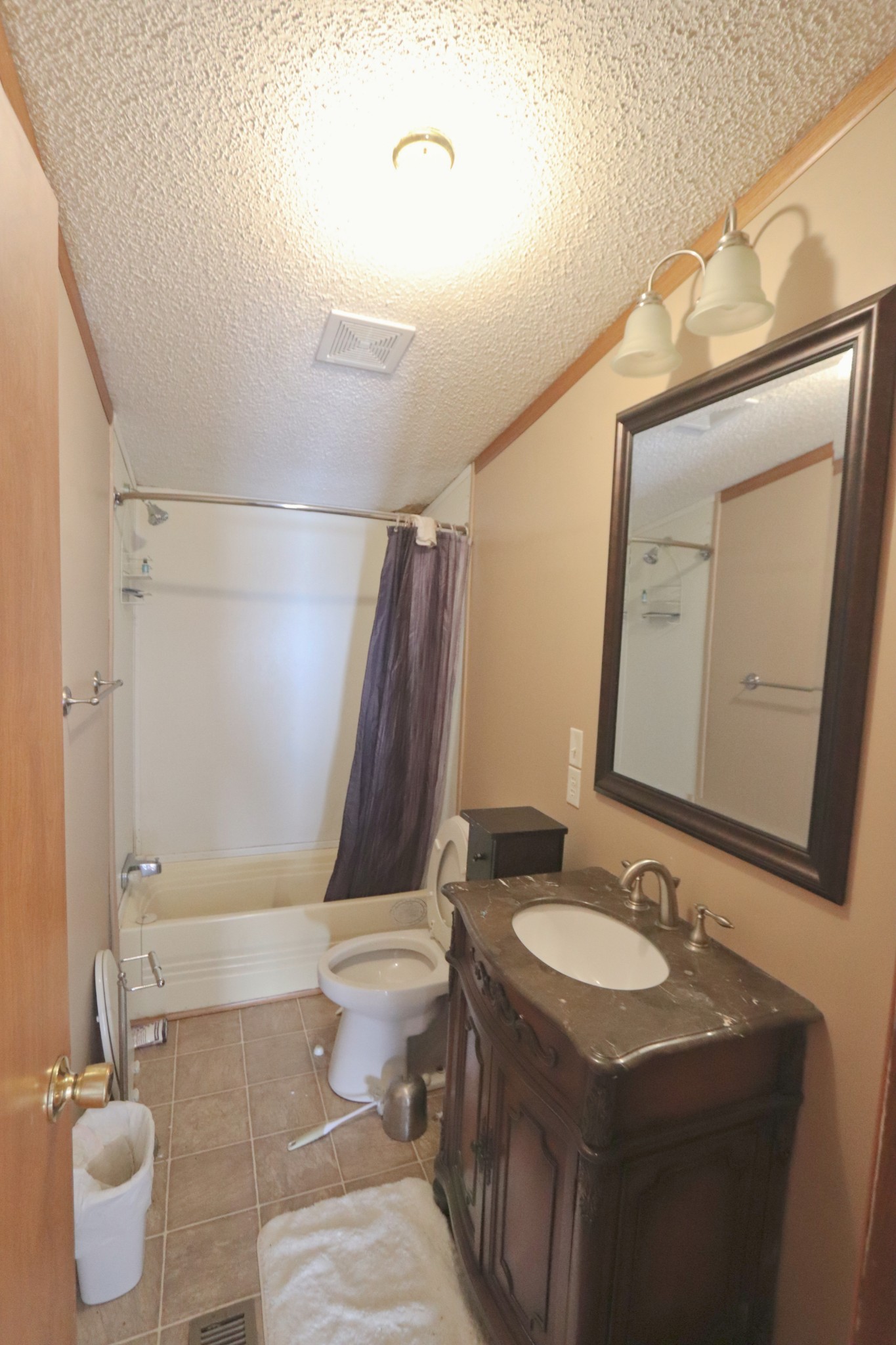 2051 Canoe Branch Road Lebanon, TN 37087 - Photo 10 of 18 a bathroom with a granite countertop sink toilet and shower