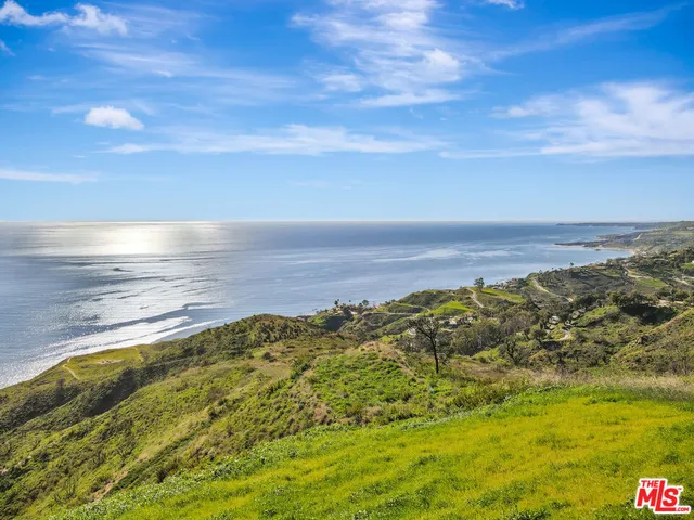 a view of an ocean and a mountain