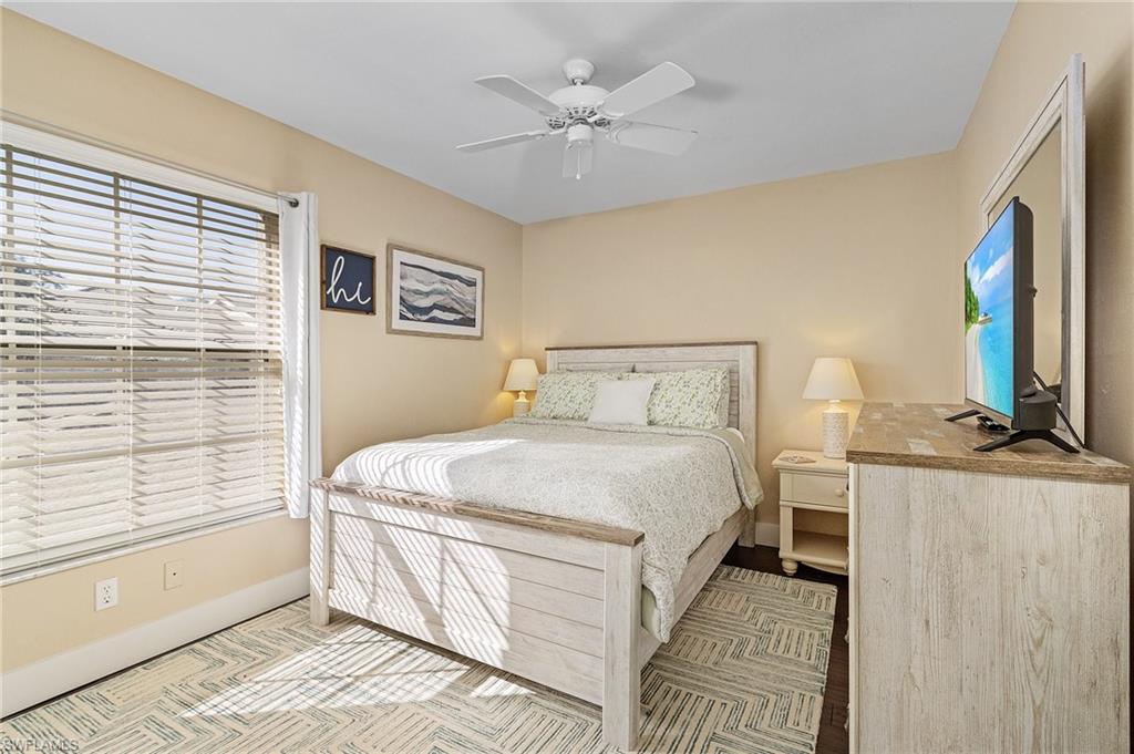 3785 Fieldstone Boulevard, Unit 208 Naples, FL 34109 - Photo 17 of 26 Bedroom with a ceiling fan