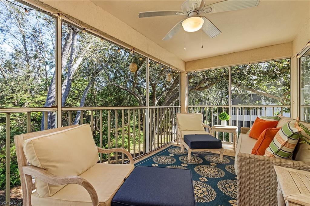 3785 Fieldstone Boulevard, Unit 208 Naples, FL 34109 - Photo 4 of 26 Sunroom / solarium featuring a lovely preserve view
