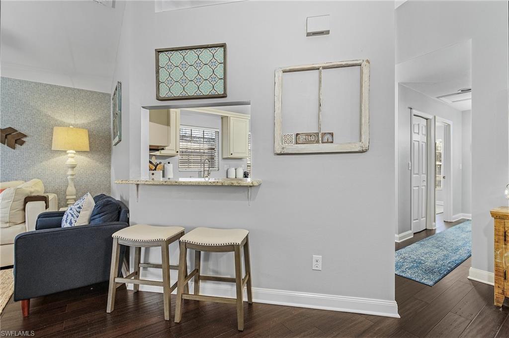 3785 Fieldstone Boulevard, Unit 208 Naples, FL 34109 - Photo 8 of 26 Area between Dining Room and Kitchen
