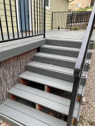 a view of staircase with wooden floor and a stairs