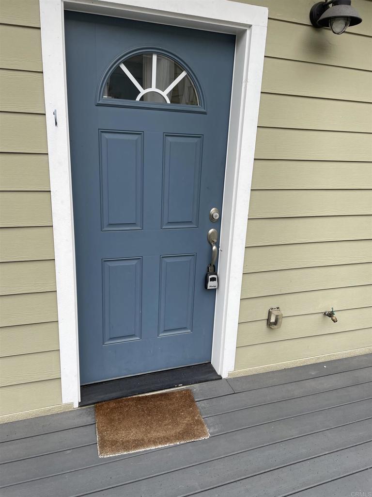 8545 Lemon Avenue, Unit 1 La Mesa, CA 91941 - Photo 16 of 28 a front view of a house with garage